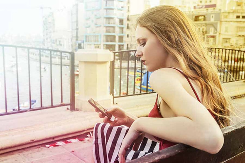 Picture of a woman looking at her smartphone