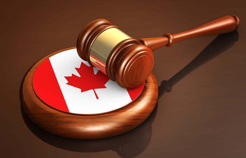 Canadian law concept with judge's gavel and Canadian flag image